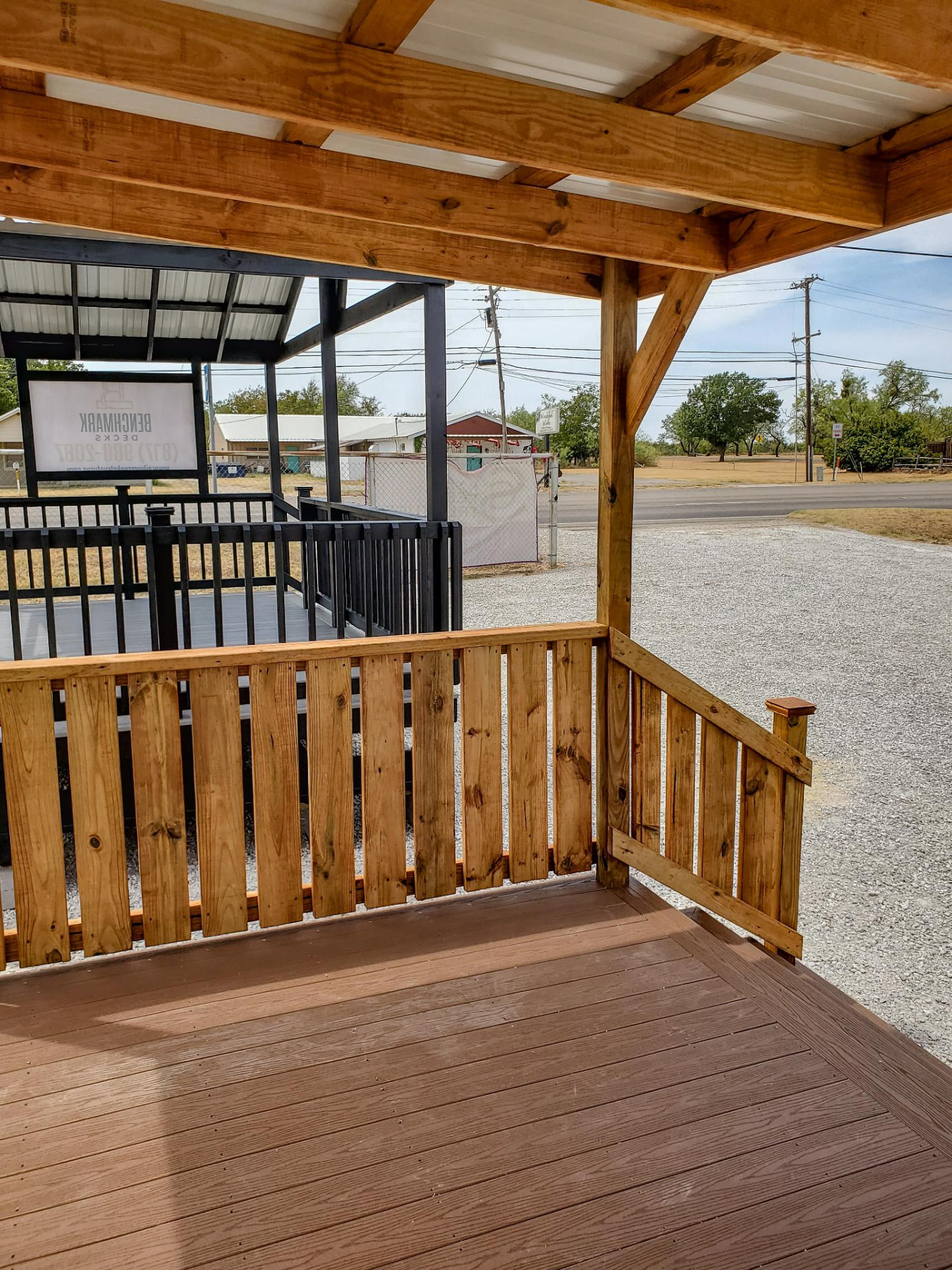 Covered deck looking out over the display lot with cedar railing