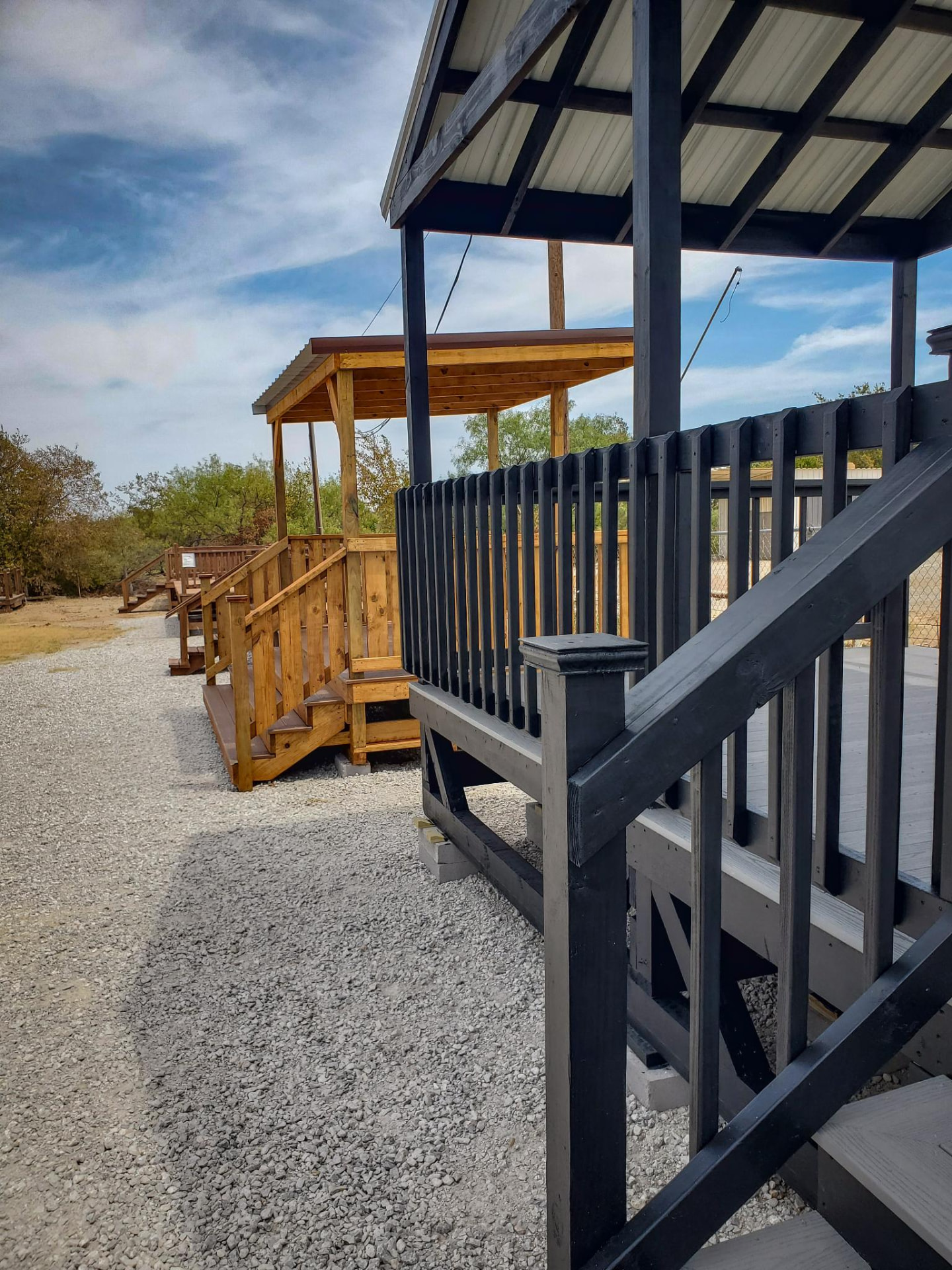 Row of display decks in cedar and black finishes