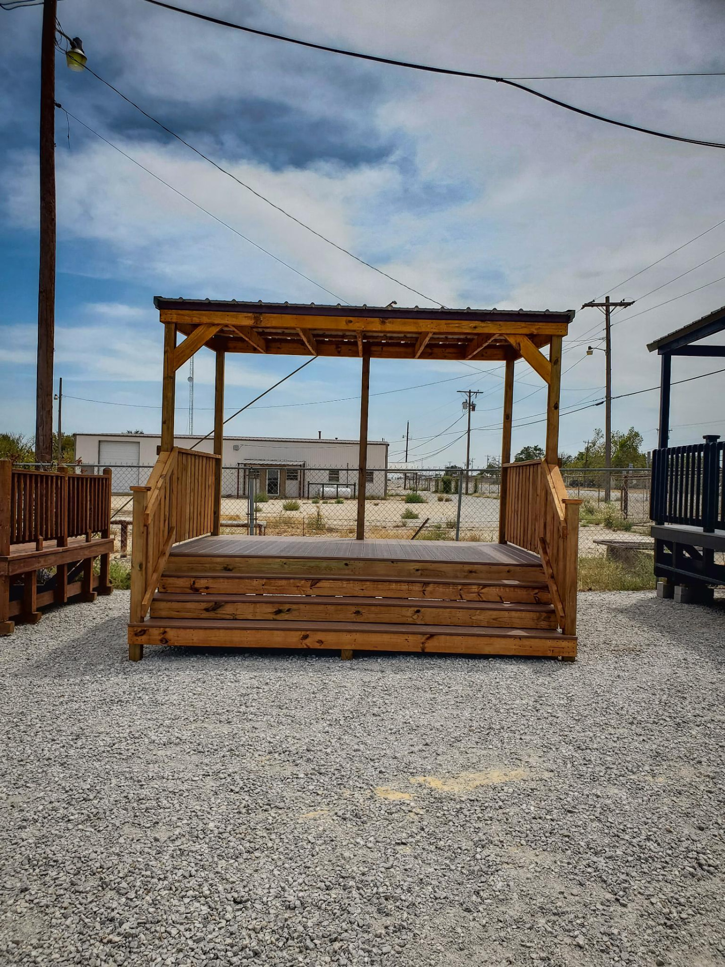 Stained composite deck with open sides available rent to own
